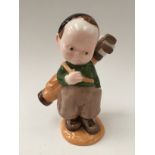 A Shelley 'Mable Lucie Atwell' figure, of a young boy golfer, marked to base, 16cm high,