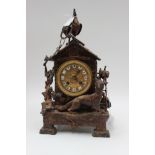 A Spelter mantel clock with fox and chicken scene and key