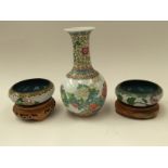 A pair of colosone bowl with stands, with a famille rose bulbous vase.