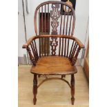 An early Victorian yew wood and elm seated Windsor chair,