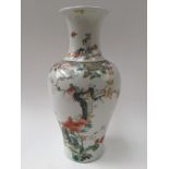A finely enamelled Chinese famille rose vase, seal mark of Qianlong,
