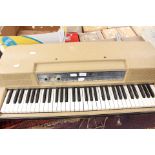 A Wurlitzer electronic piano with legs, no lead, circa 1960s,