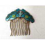 A silver gilt hair comb, having enamelled butterfly,