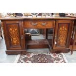 A late Victorian mahogany and marquetry inlaid writing kneehole desk, leathered writing surface,