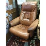 A designer brown leather revolving office chair,
