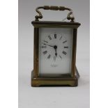 A 19th Century brass cased carriage clock, having a white enamelled dial and black Roman numerals,