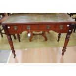 A mid Victorian mahogany writing desk, having a leather inset writing surface, having three drawers,