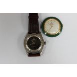 Two watches comprising a circa 1960s vintage Universal Polerouter steel watch and a twenty Dollar