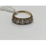 A Victorian five stone diamond ring, the centre old cut stone approx 0.