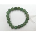 A Jade bracelet of green beads