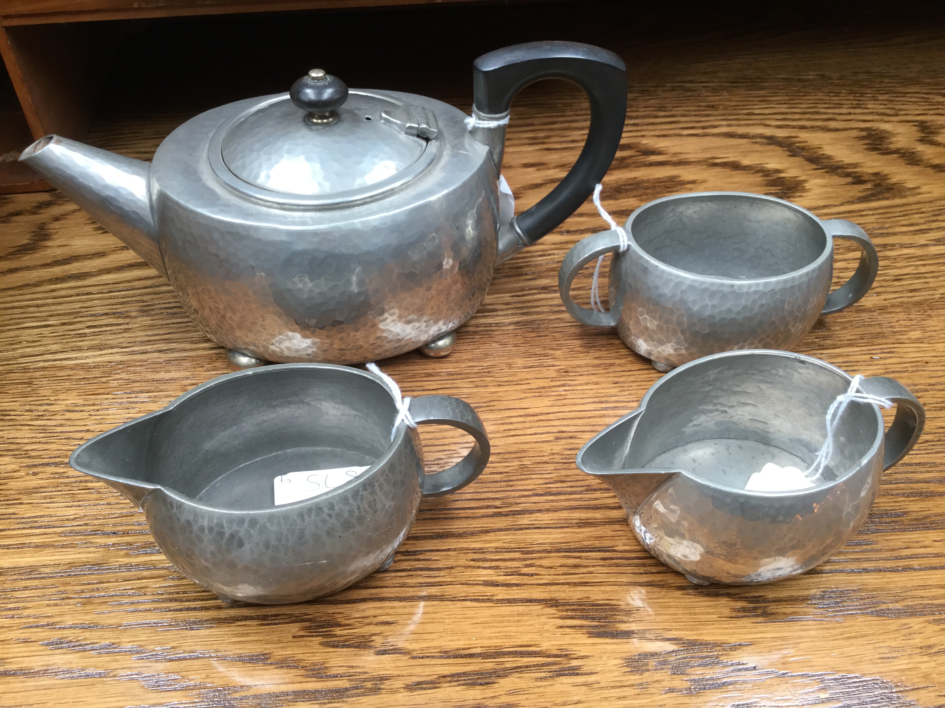 Liberty, a Tudric pewter Arts and Crafts four piece teaset, planished, on four feet, - Bild 2 aus 2