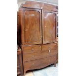 A late Georgian mahogany two door linen press