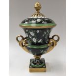 A Dresden pot pouri urn and cover, black ground, foliate decoration, gilded handles,