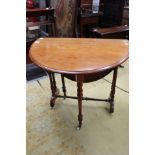 An Edwardian mahogany Sutherland table, turned legs,