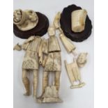 Two ivory carved figures, man smoking a pipe and man with basket, both with hardwood plinth,