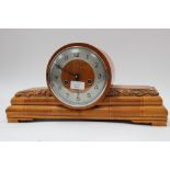 A mantle clock, Arabic numerals to dial,