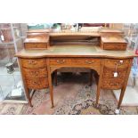 An Edwardian Carlton House mahogany and satinwood inlaid desk