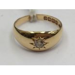 An 18ct gold and diamond star set ring, size M, approx 0.10ct, total weight 4.