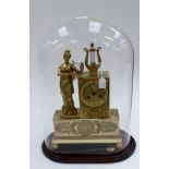 A French gilt bronze circa 1860/1880 striking clock with Classical figure playing lyre,