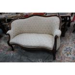 A 19th Century walnut cream chevron patterned upholstered settee, carved frame,