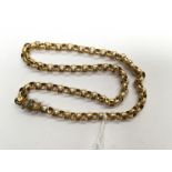 A yellow metal link necklace with barrel clasp set turquoise,