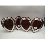 A matched pair of double heart-shaped photograph frames.