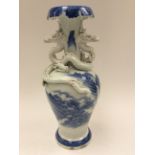 A Chinese early 19th Century baluster vase, blue and white mountain and sea scene,