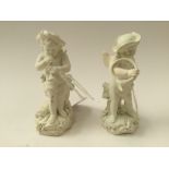 A pair of Derby biscuit figures of cherubs as musicians, one playing a pipe the other a French horn,