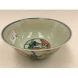 A Chinese Doucai porcelain rice bowl of rounded form with slightly flared rim,