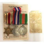 WW2 British Medals Africa Star, Defence Medal and War Medal complete with ribbons and slip.