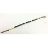 A Swagger Stick 49cm long with white metal and ivory mounts on wood. Has a 6cm blade within.