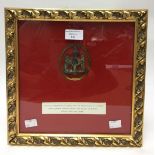 Napoleonic Wars. A framed Prussian soldiers cap badge. Eagle with Crown and downswept wings.