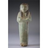 Egyptian Faience Shabti Figure, Third Intermediate Period, C. 730 BC.  A light green glazed