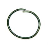 Iron Age Armlet, 5th-1st century BC A bronze round-section penannular torc armlet with panels of