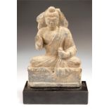 Gandhara Meditating Buddha Statuette, 2nd-3rd century AD A schist statuette of Buddha, hair pulled