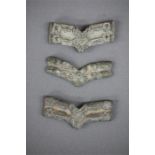 Silver Belt Plates, 9th-12th century AD.   A group of three silver belt plates, two with stylised