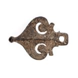 A bronze horse harness pendant, shaped as a heart shaped stylised ivy leaf with openwork crescents