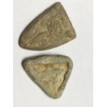 A pair of early Medieval lead shield trade weights. 31mm and 27mm. Provenance: Ex. A. R Halliday