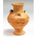 A ceramic vessel with flared mouth and tapering neck. Rounded shoulder with applied looped