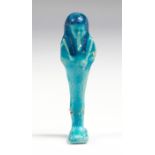 Egyptian Ptolemaic Period Faience Shabti, C. 4th Century BC. A bright blue faience mummiform