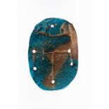 A faience pectoral scarab with holes for attachment. Size: 5.5cm. Provenance: Ex. Mustaki