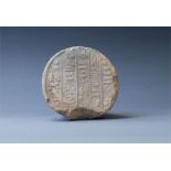 Funerary Cone, New Kingdom, 1550-1077 BC. A ceramic cone with the wide, flat end stamped with a