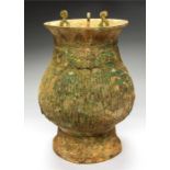 Western Zhou Dynasty Decorated Lidded Vessel, 1047-772 BC A bronze vessel with flared rim, sloping