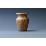 Kohl Pot, New Kingdom, 1550-1077 BC A alabaster kohl pot with wide, flat rim, waisted neck and