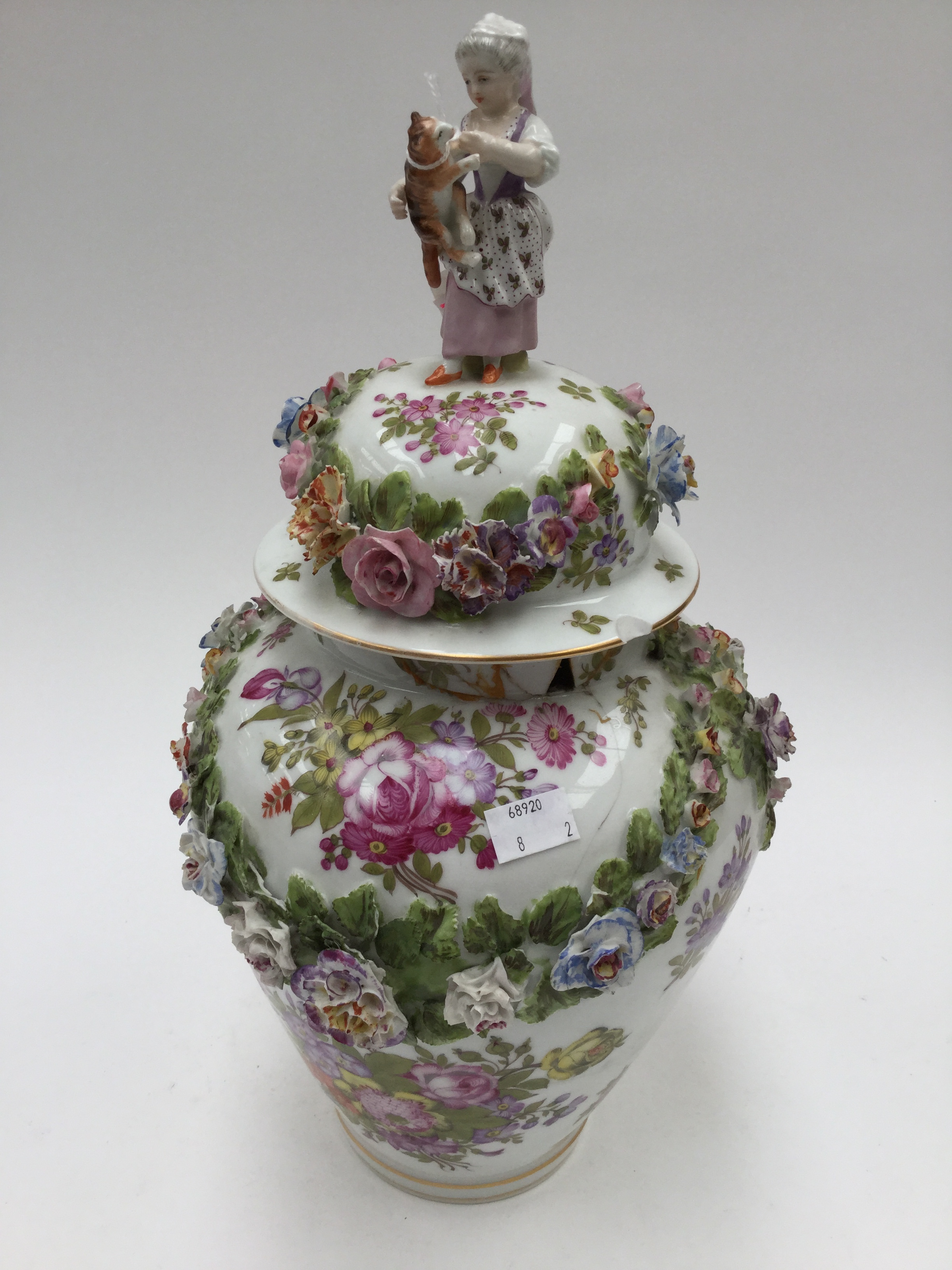 A large Meissen baluster vase and cover, painted with floral sprays and applied swags of flowers, - Image 2 of 3