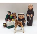 A Royal Doulton Old Balloon Seller HN 1315, a Beswick Giraffe,