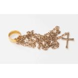 A 22ct gold wedding band (5.1g approx), two 9ct gold chains and cross (14.4g approx).
