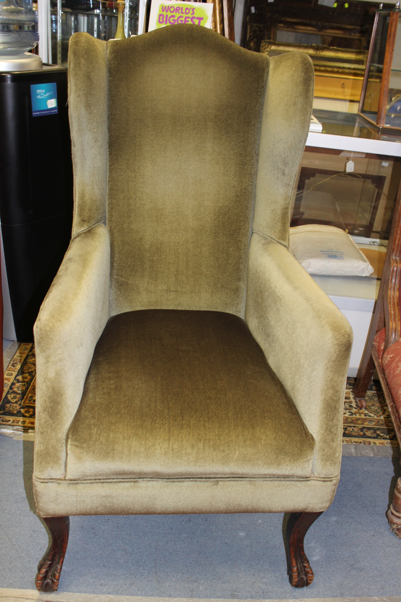 A late Victorian upholstered wing chair, green upholstered seat,
