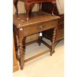 An early 20th Century oak side table, fitted with a single drawer,