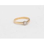 A diamond solitaire 18ct gold ring, the round brilliant cut diamond weighing approx 0.